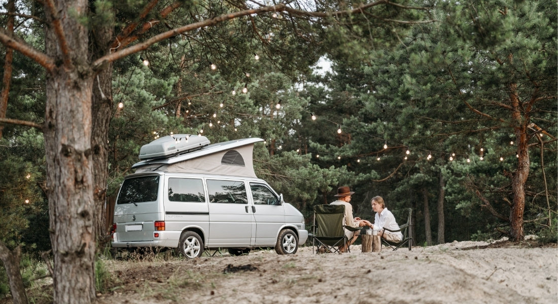Travelers in front of their van rental in Canada