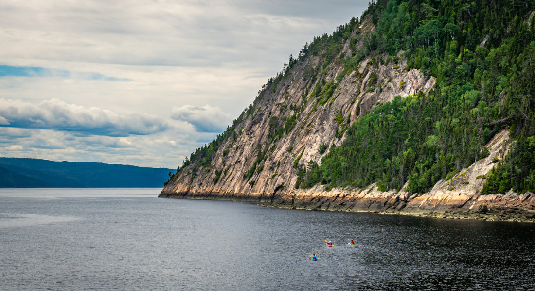 Saguenay Fjord kayak at the foot of the Saguenay Fjord cliffs