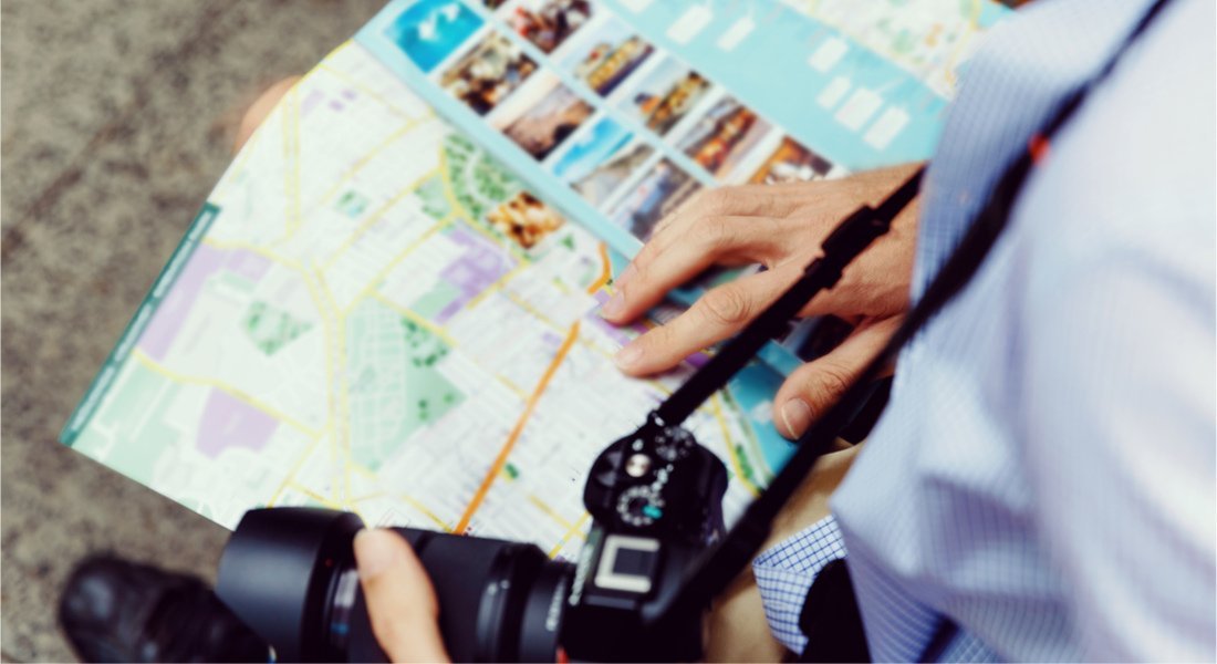 Tourist consulting a map of Montreal