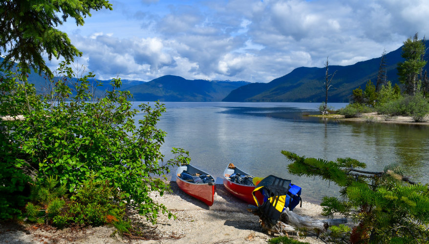 Two canoes docked at the edge of Murtle Lake