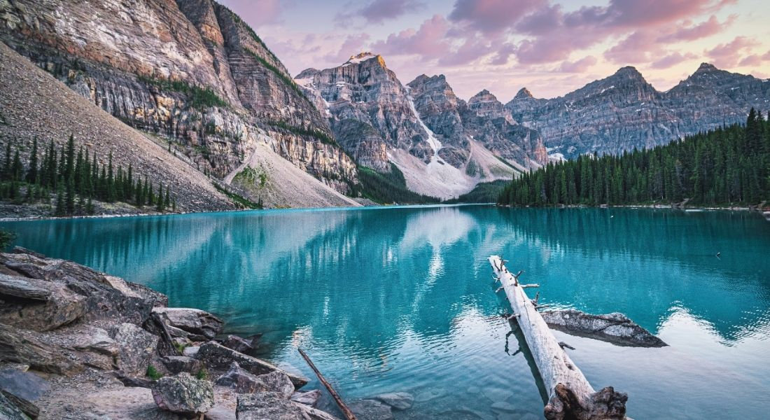 Banff National Park Canada Lake with turquoise water surrounded by snow-capped mountains in Banff