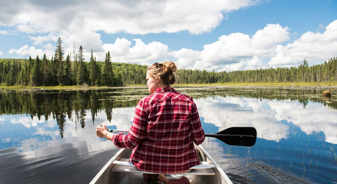 Algonquin Provincial Park in Ontario Woman in a canoe in Algonquin Provincial Park