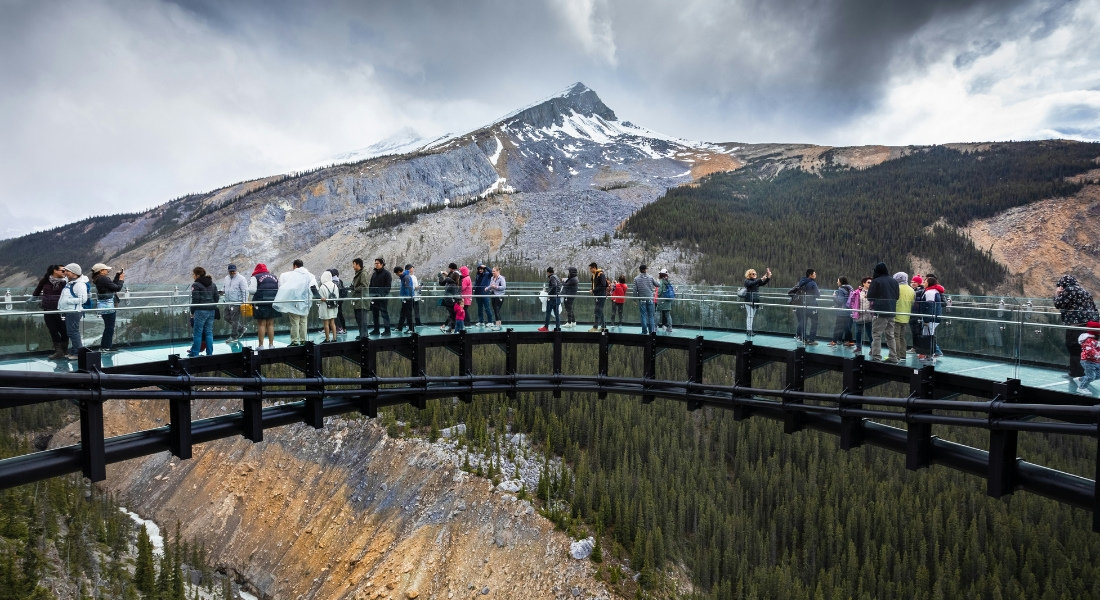 Tipping Rules in Canada Tourists on the footbridge on the Icefields Parkway in Canada