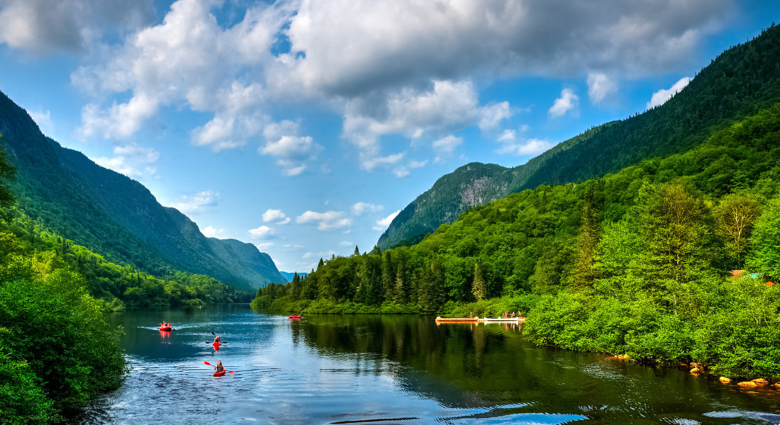Choosing a Canada specialist agency People kayaking on the river in Jacques Cartier National Park in Quebec