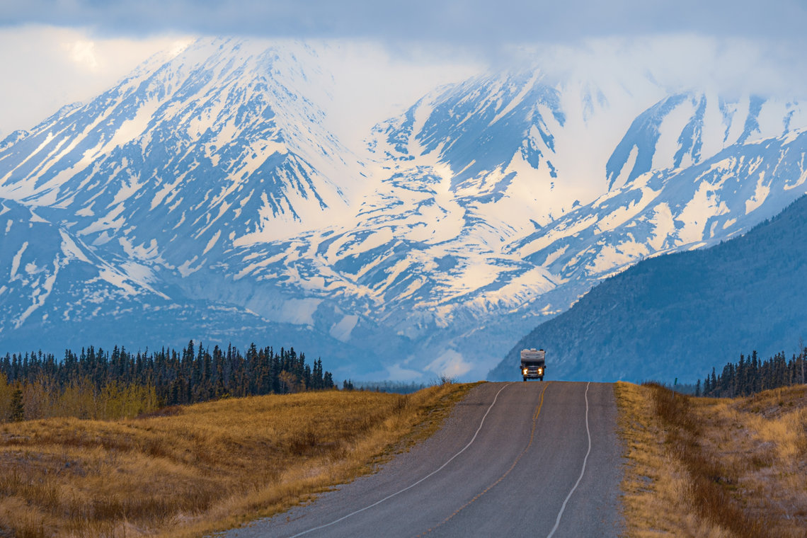 A Canadian road with a magnificent view of the snow-capped mountains