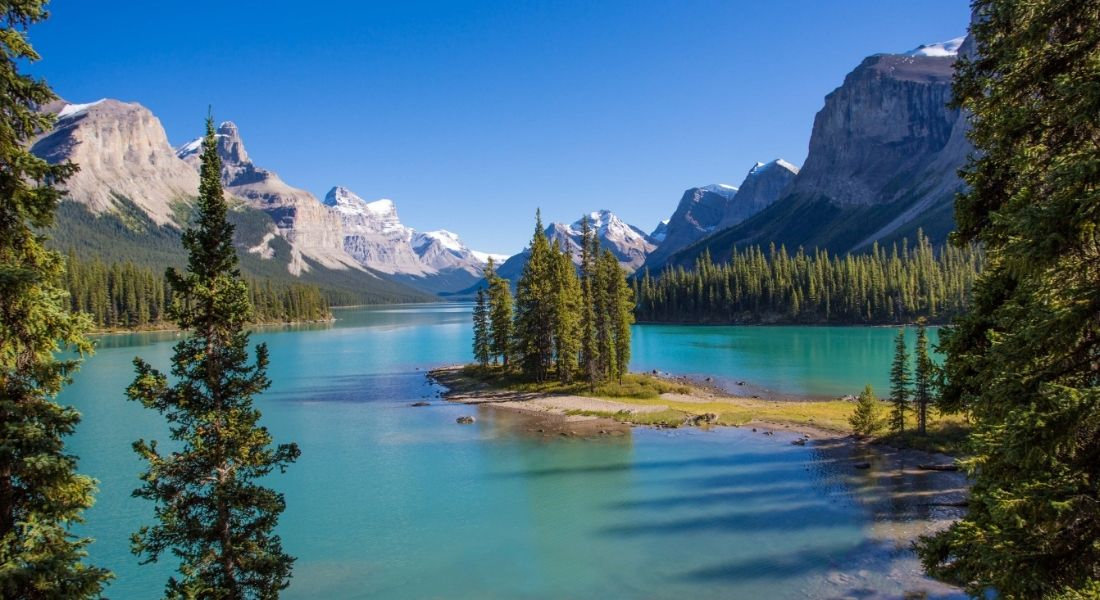 Jasper National Park Spirit Island surrounded by emerald waters and mountains in Jasper National Park