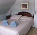 Chambre avec salle de bain partagée