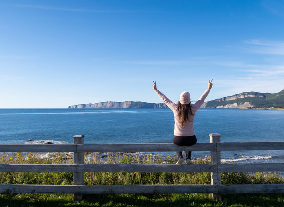 Woman facing the coast in Quebec