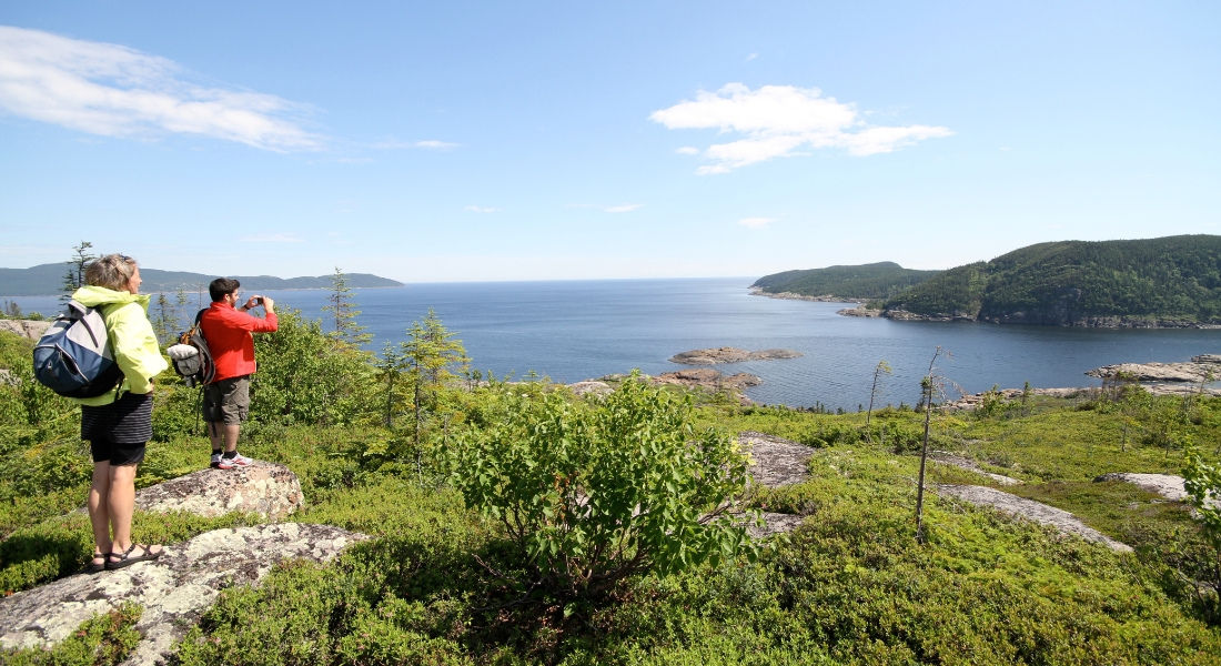 Hikers facing the River on the Archipelago of the seven islands