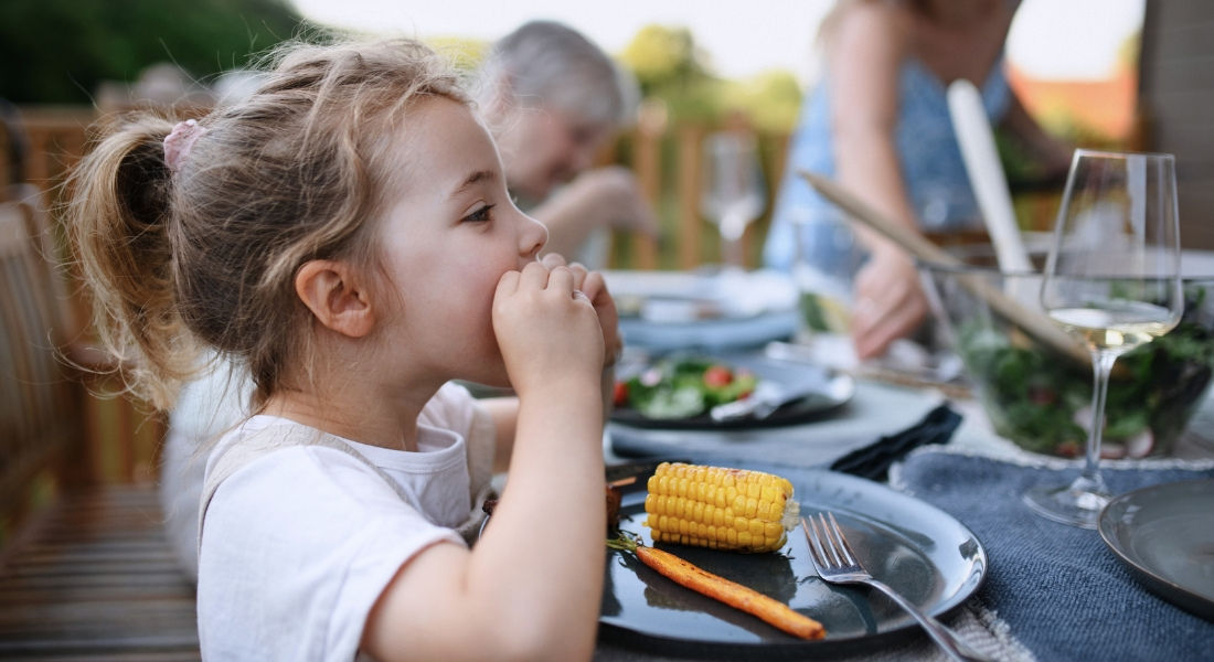 Customs in Canada Child enjoying a corn roast
