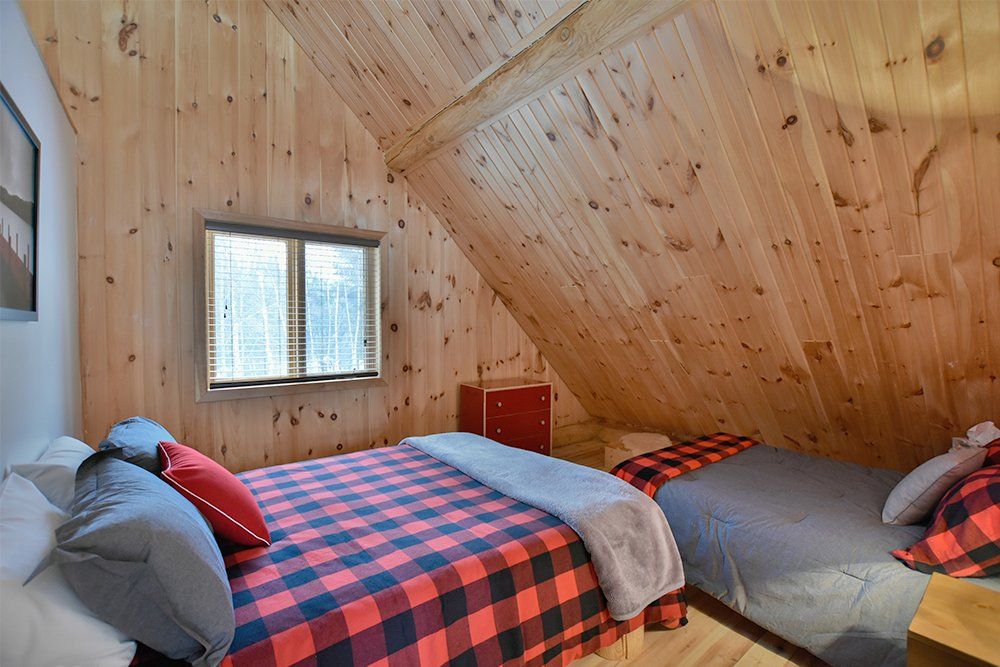 Chalet en bois rond Le Pinecone - Chambre avec 2 lits-2