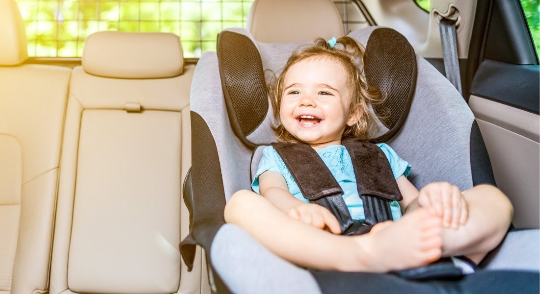 Little girl in car seat in California rental car