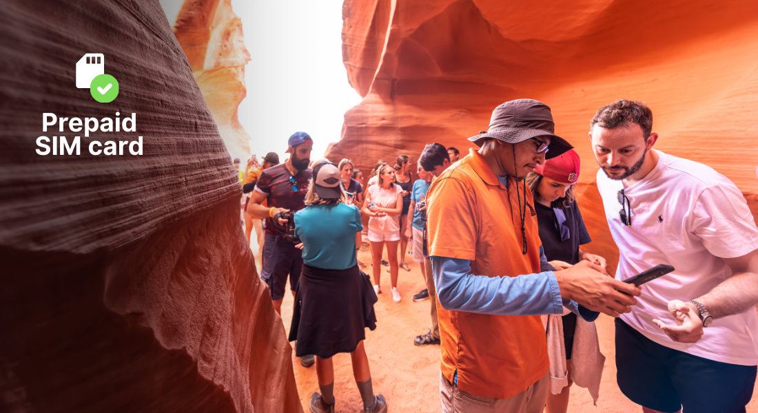 A group of travellers checking a phone