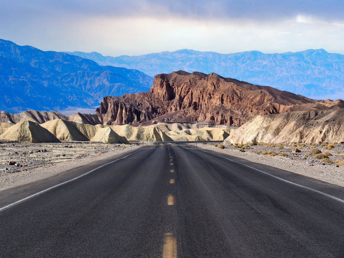 A road in the United States with mountain views