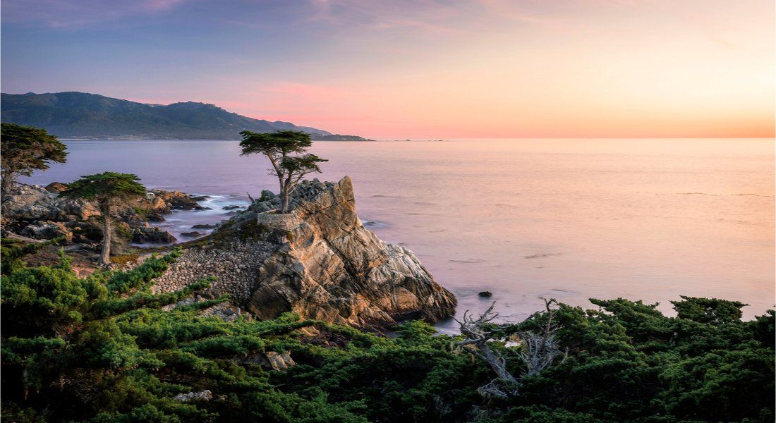 @Dominic Jeanmaire - shutterstock_1434057998 rocky outcrop on the Pacific coast at sunset
